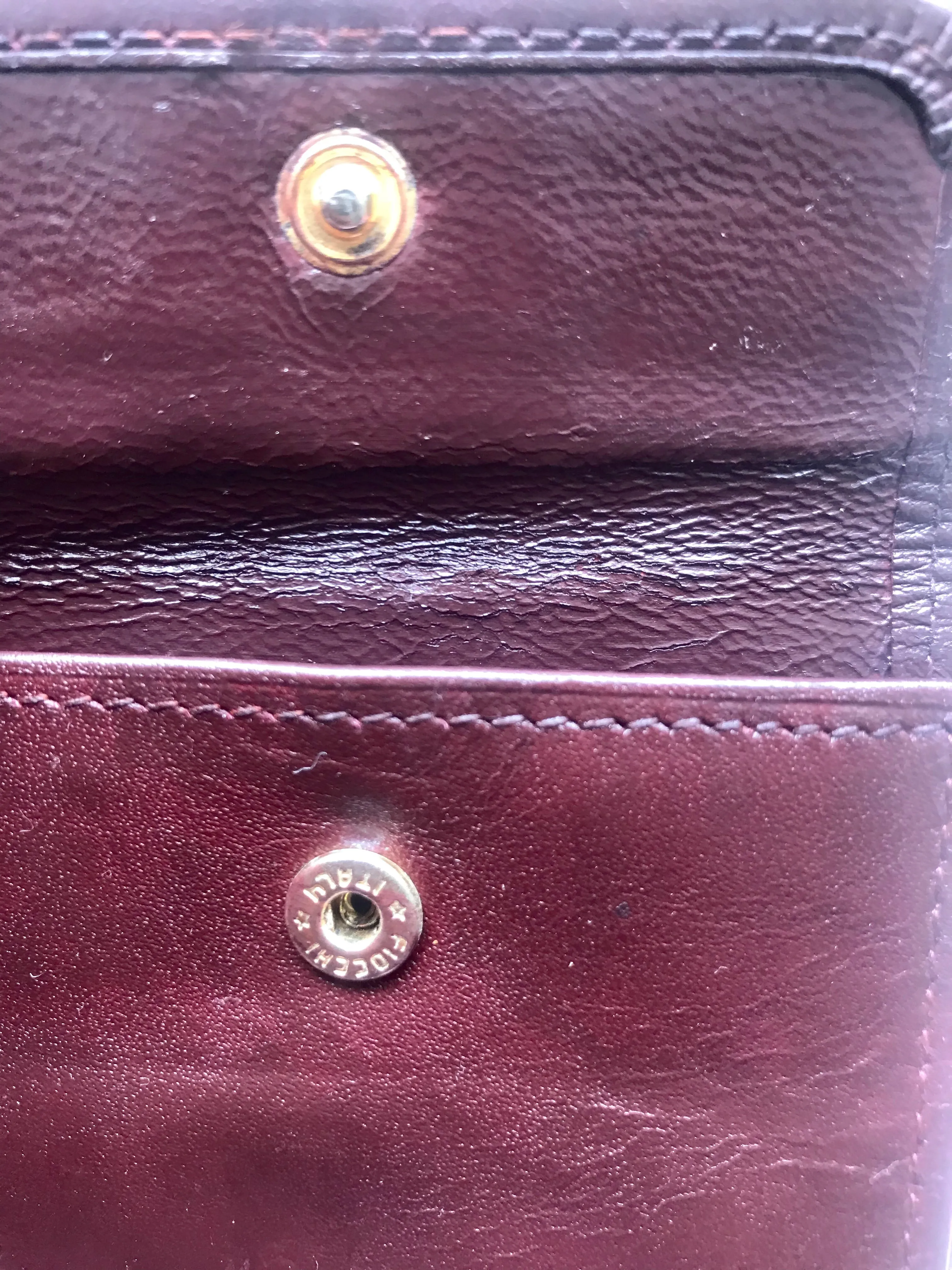 Vintage Cartier, must de Cartier wine leather square wallet with gold tone frames. Unisex use.